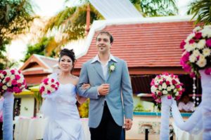 Aree & Phil smiling at their Phuket wedding by Grandforest